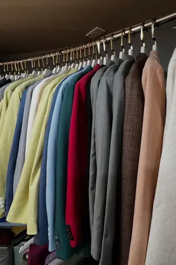 A rail of jackets in many colours and fabrics